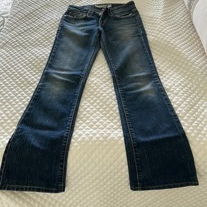 Joes Jeans flare bottom low rise dark rinse denim back left rear small patch